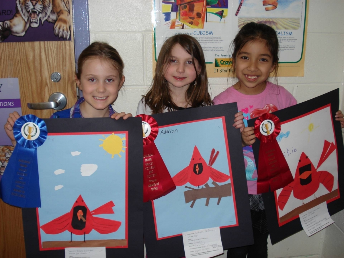 3 girls with their artwork